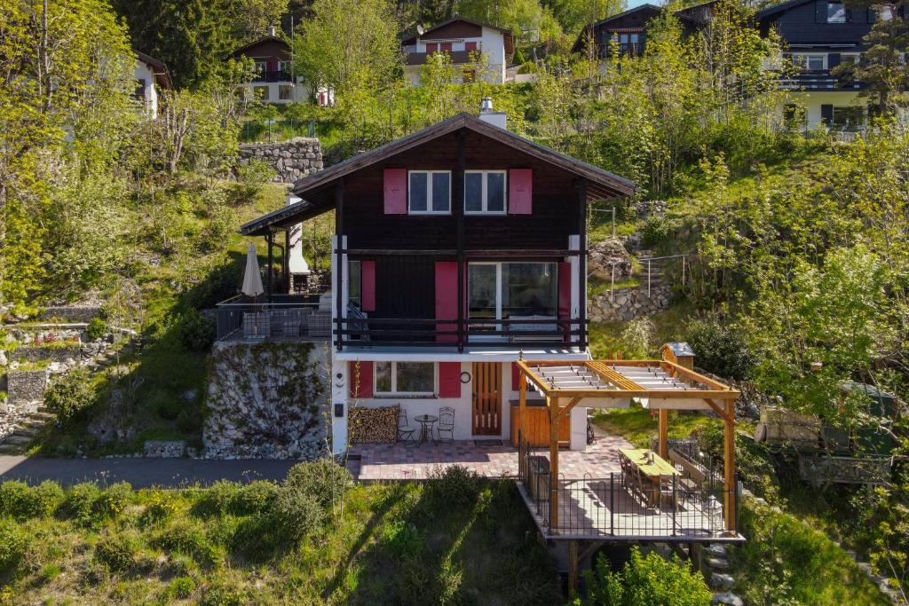 an aerial view of a house on a hill at Chalet Ravenstein in Fiesch