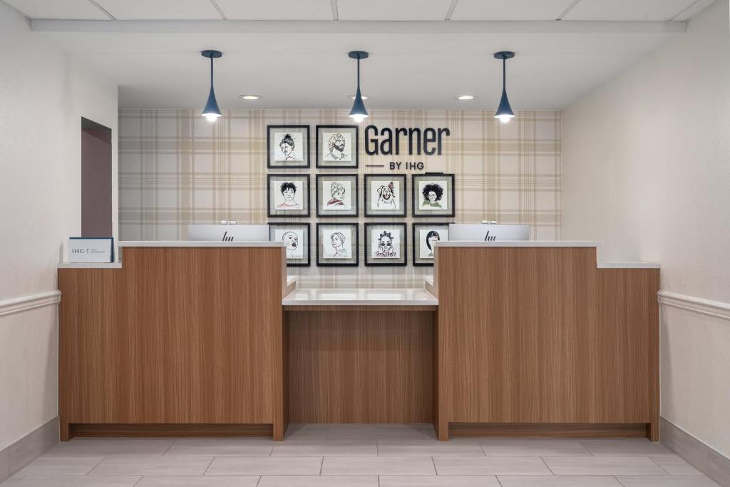 a waiting area of a vet clinic with a counter at Garner Hotel Houston - Westchase by IHG in Houston