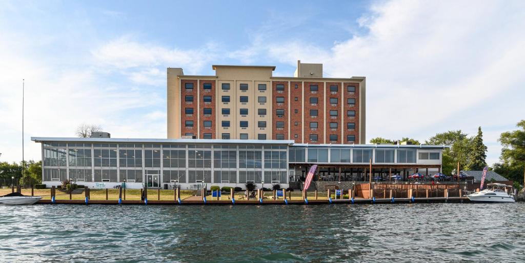 a large building next to a body of water at Crowne Plaza Niagara Falls NY - Riverside by IHG in Niagara Falls
