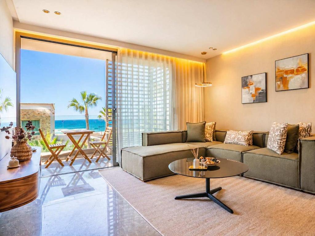 a living room with a couch and a table at The Magic Place - Ocean Walk and Pool Access in Anfa-Supérieur
