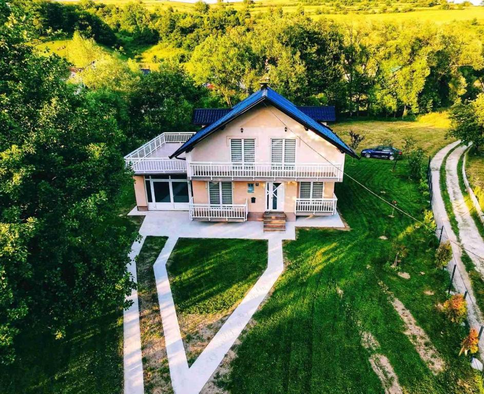 an overhead view of a house in a field at Villa Riverside Haven in Hadžići