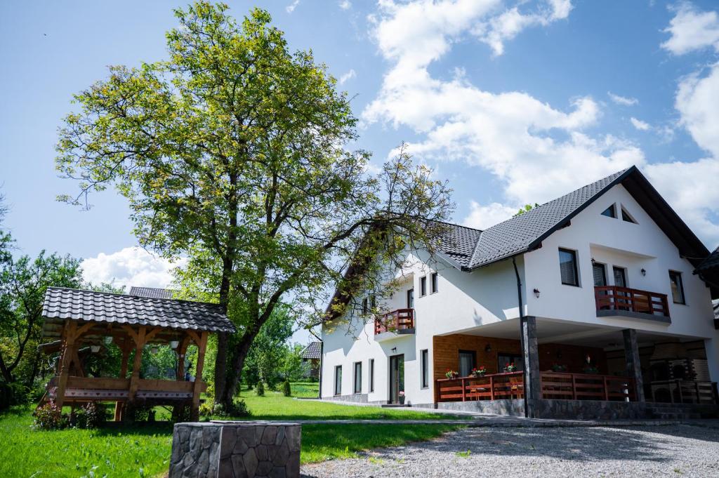 a large white house with a gazebo at Breb 155 in Breb