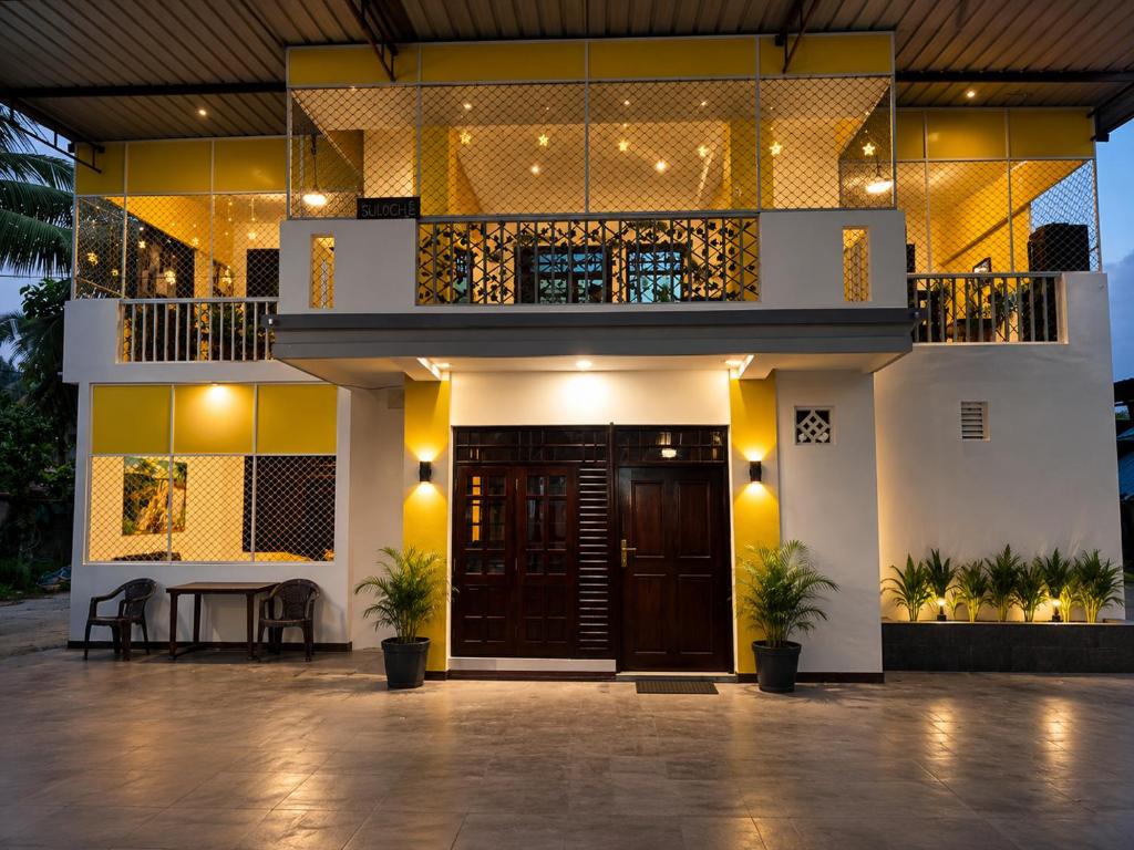 a facade of a house with a front entrance at Beach Guest House Addalaichenai in Addalachenai