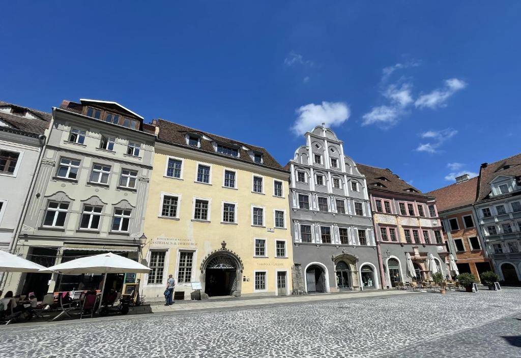 a group of buildings on a city street at Herberge Zum Sechsten Gebot in Görlitz