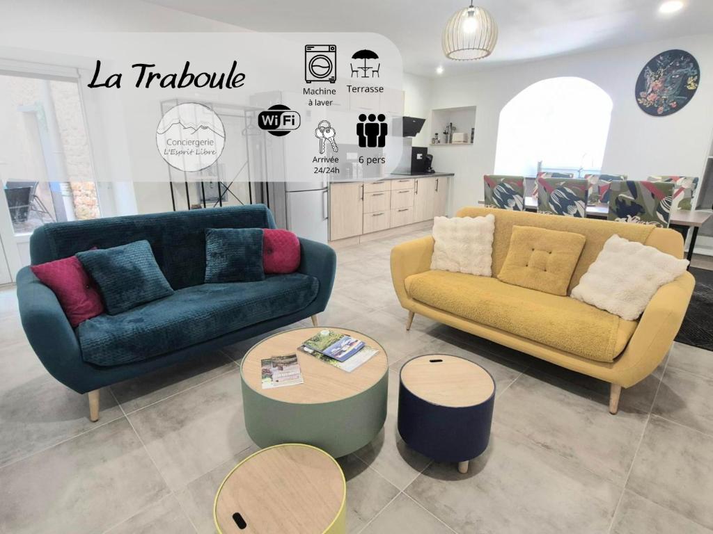 a living room with two couches and a table at La Traboule - Terrasse - 6 pers in Saint-Germain-Lembron