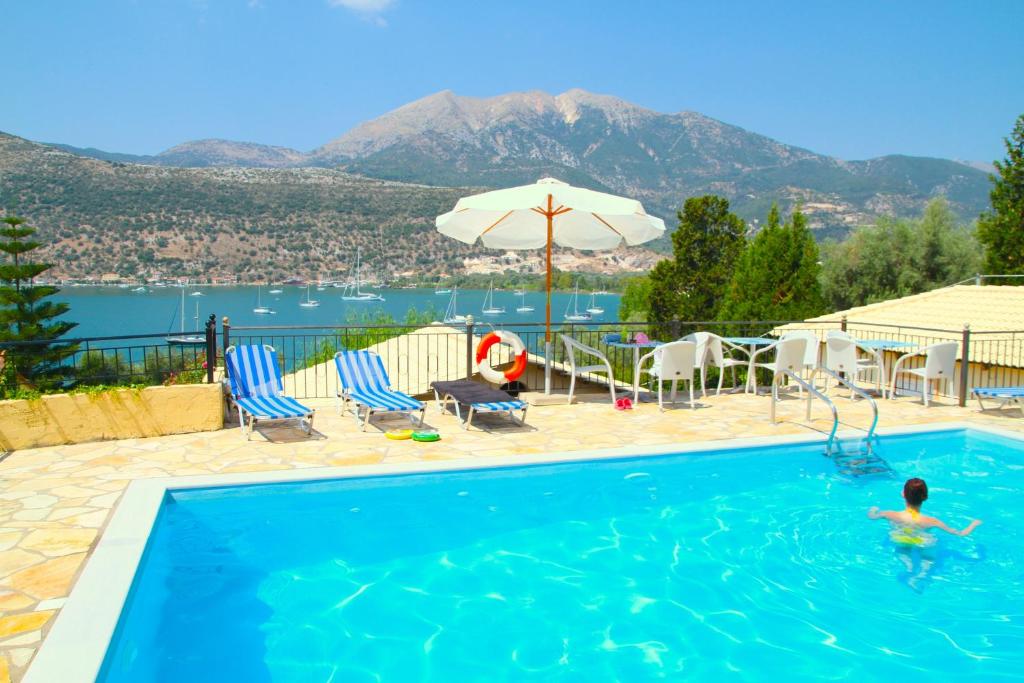 a swimming pool with a man in the water at Armonia Nakas in Yenion