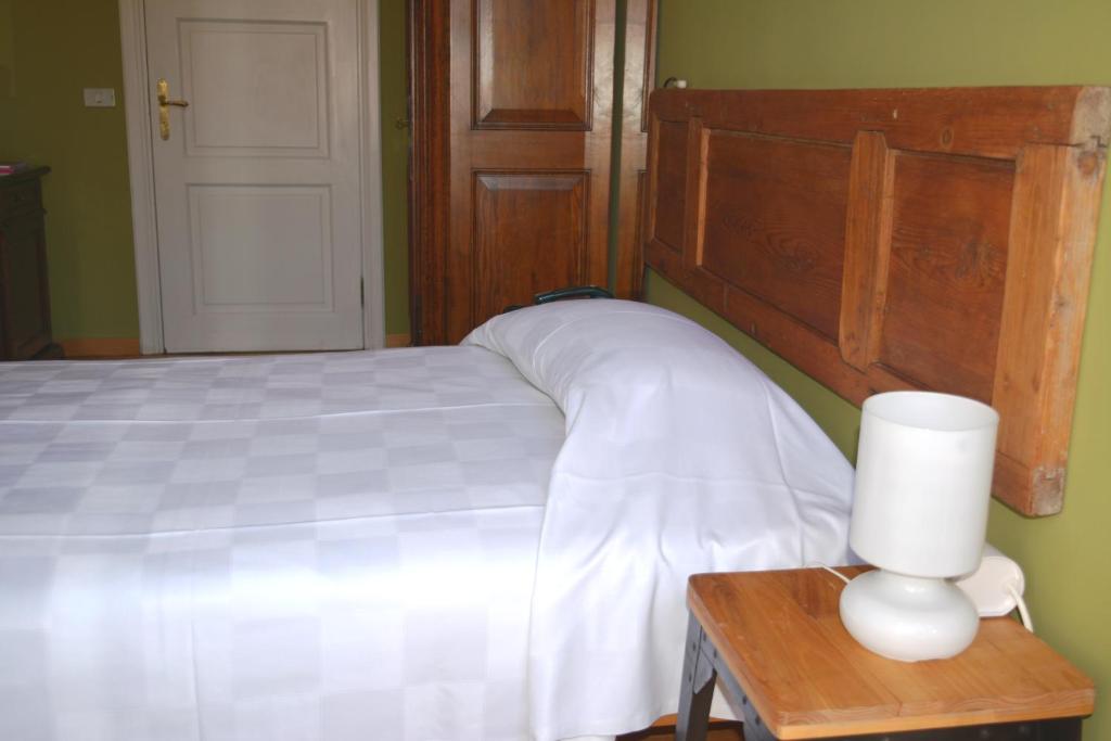 Posteľ alebo postele v izbe v ubytovaní Albergo Bologna