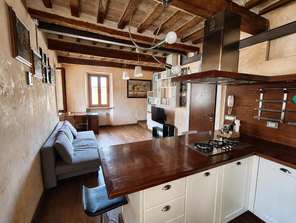 a kitchen with a counter top in a room at Suite Rosso 24 in Iesi