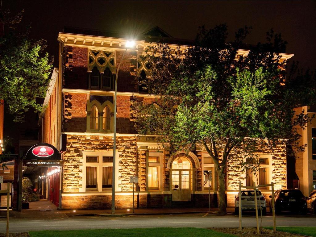 a building with a street light in front of it at Adabco Boutique Hotel Adelaide in Adelaide