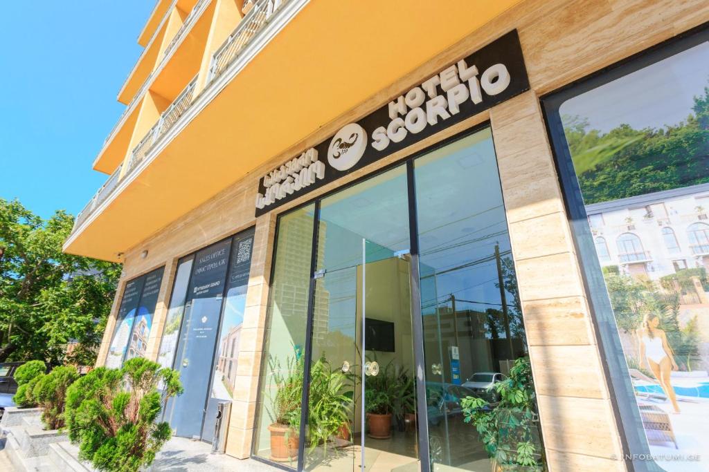 a store with a sign on the front of it at Hotel Scorpio gonio in Gonio