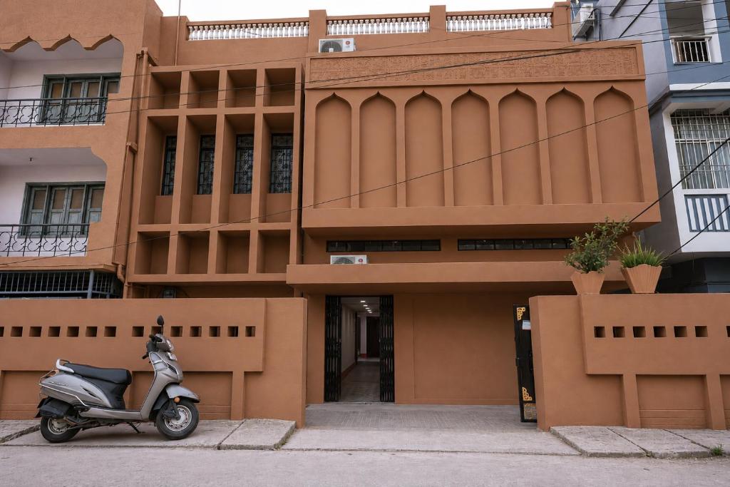 a scooter parked in front of a building at Hotel Subarnrekha Heritage- Lalpur, Kanke Road in Rānchī