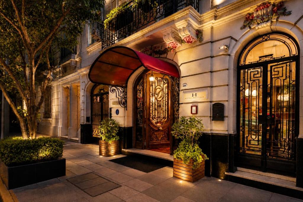 an entrance to a building with a large wooden door at Duque Hotel Boutique & Spa in Buenos Aires