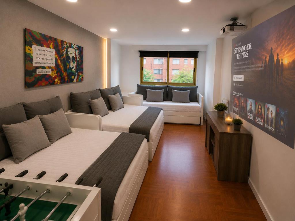 a living room with two beds and a couch at La Casa de los Inventos in Burgos