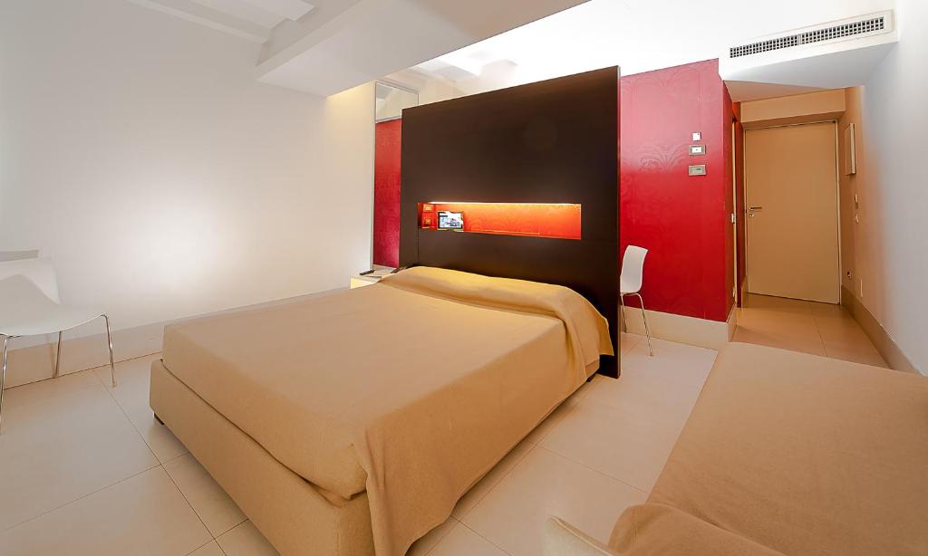 Postel nebo postele na pokoji v ubytování Savoy Hotel