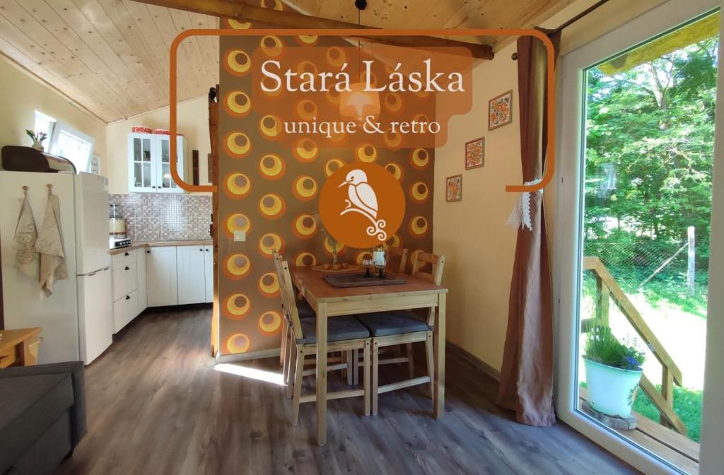 a table in a tiny kitchen in a tiny house at Unique Dutch Retro House "Stará Láska" - Natural Slovakia in Modrý Kameň