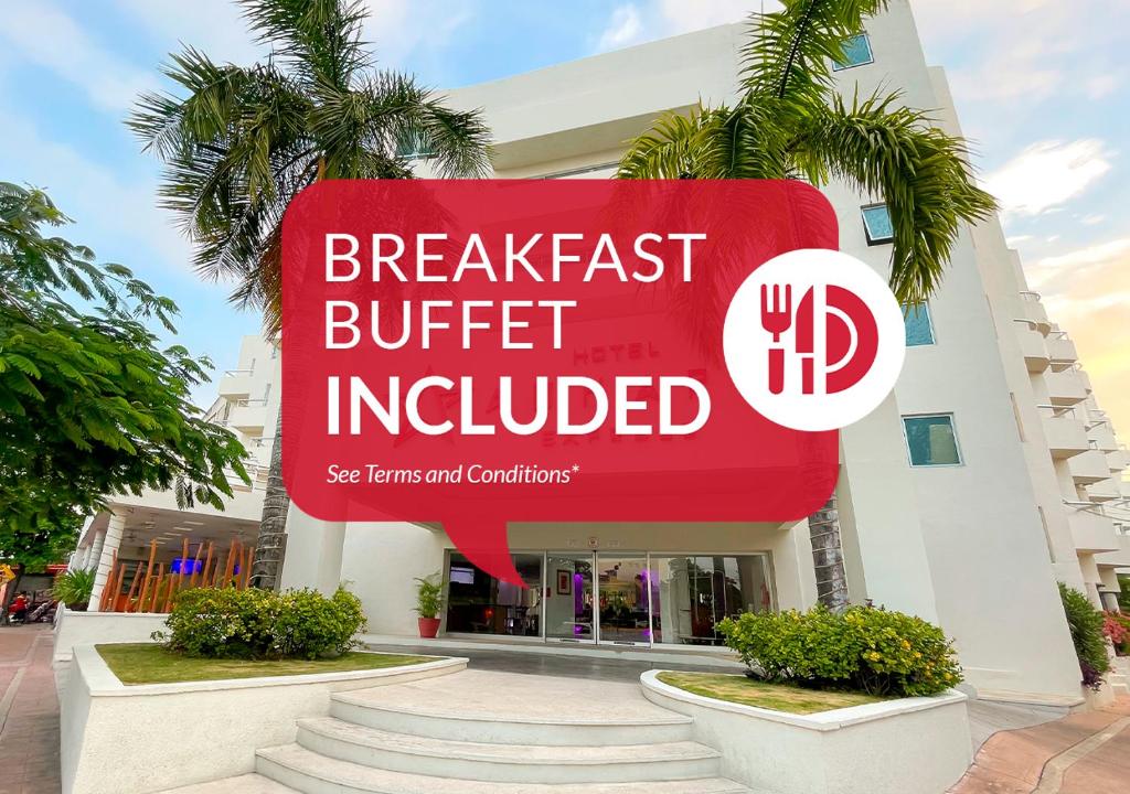 a sign in front of a building that reads breakfast buffet included at Adhara Express in Cancún