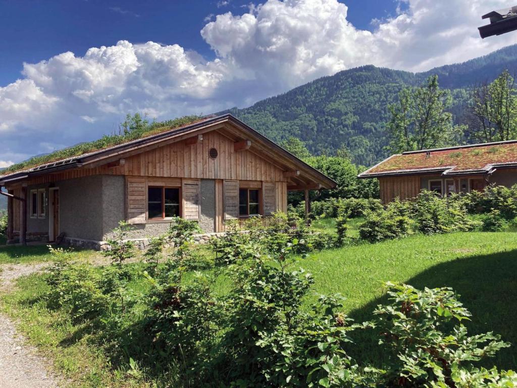 a small house in the middle of a field at Buchen 54 in Lake Pressegg