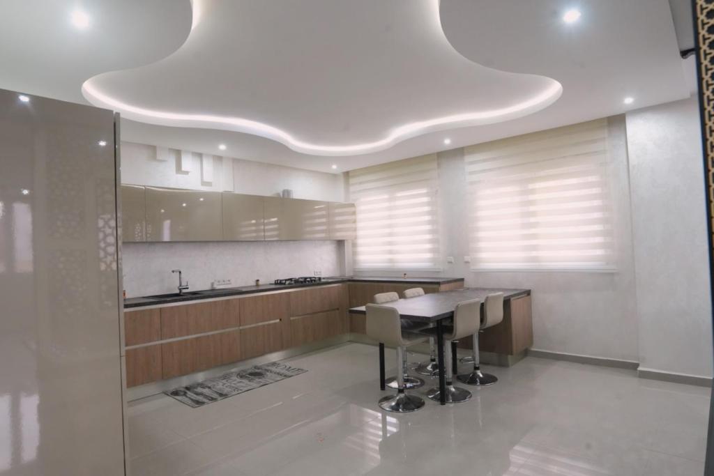 a kitchen with a table and a counter top at Tamraght Ocean View in Tamraght Ouzdar