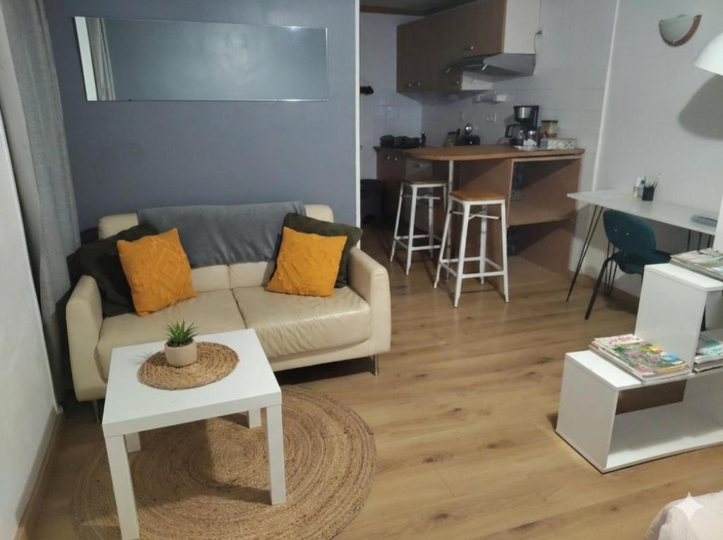 a living room with a couch and a table at studio centre de Gap in Gap