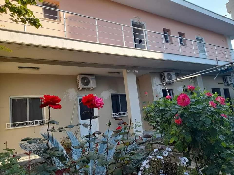 a house with flowers in front of it at Rezidenca Nanaj in Vlorë