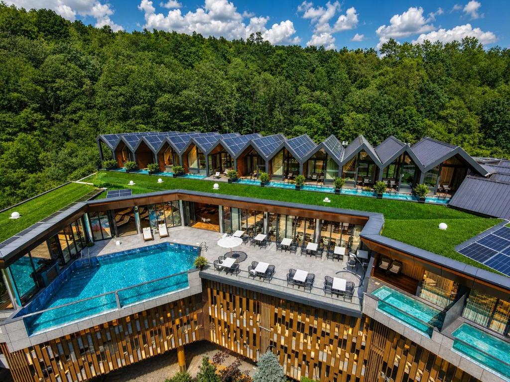 an aerial view of a house with a swimming pool at Resort Ujevara e Drinit in Peje