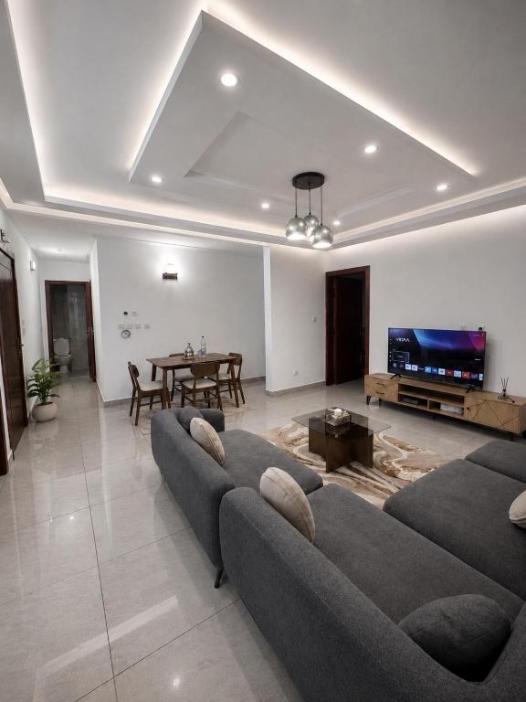 a living room with a couch and a table at Djess service in Abidjan