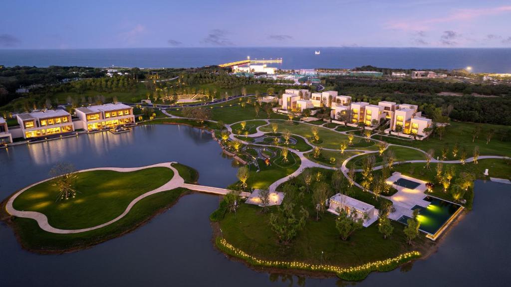 an aerial view of a resort in the water at Hotel Indigo Beidaihe by IHG in Qinhuangdao