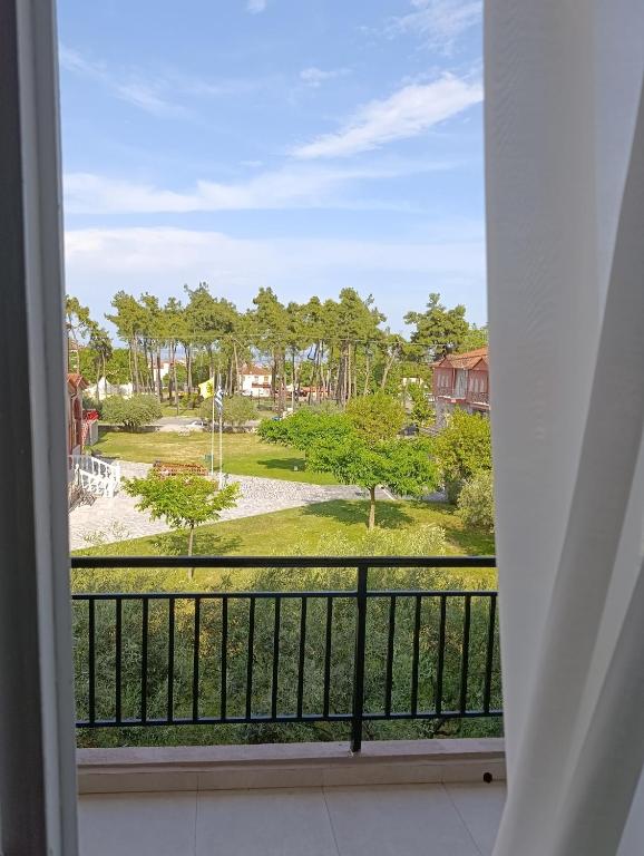 a view of a park from a balcony at Canvista in Leptokarya