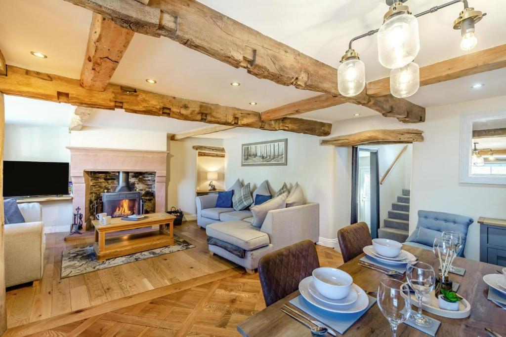 a living room with a table and a fireplace at 2 Bed in Penrith oc-87349 in Penrith