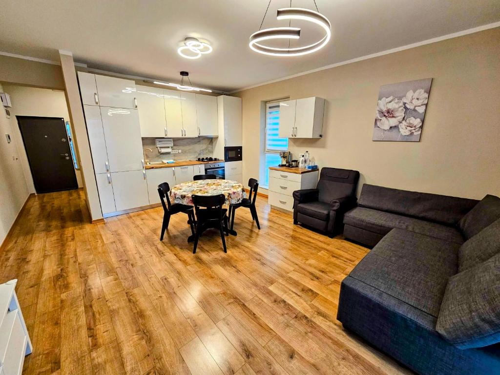 a living room with a couch and a table at Ana Residence in Timişoara