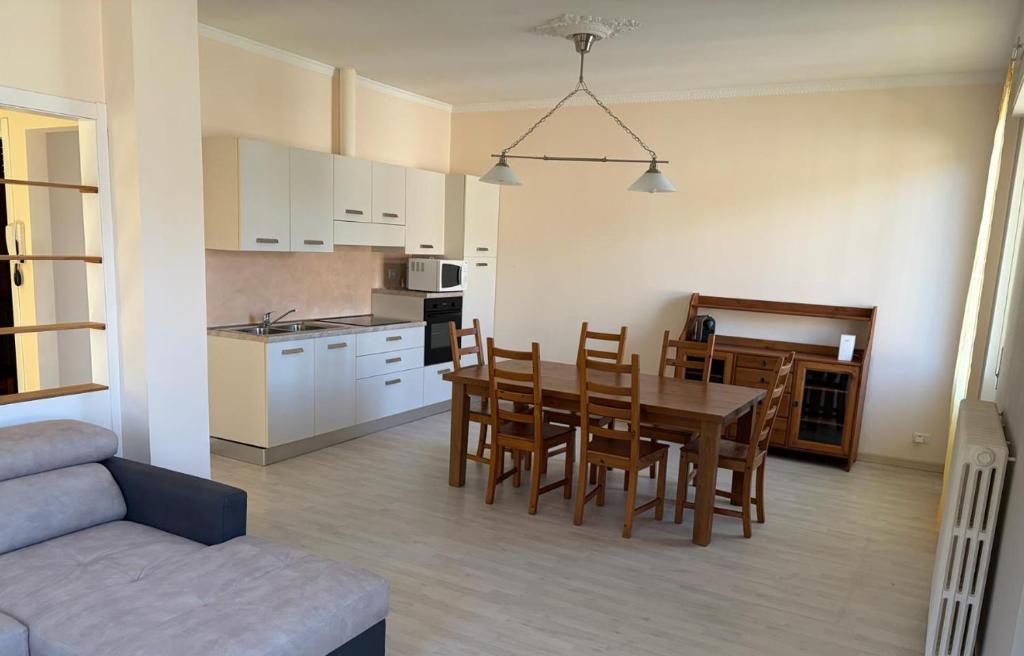 a kitchen and dining room with a table and chairs at Ca' Sonenga in Menaggio