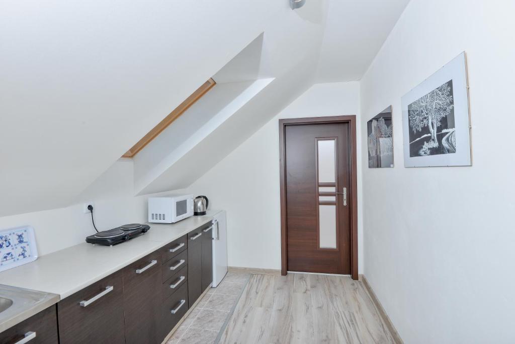 Kuchyň nebo kuchyňský kout v ubytování Apartments ADANA