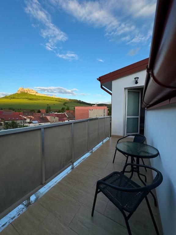 a balcony with a table and two chairs on it at Apartmán JAMI REZIDENCIA in Spišské Podhradie