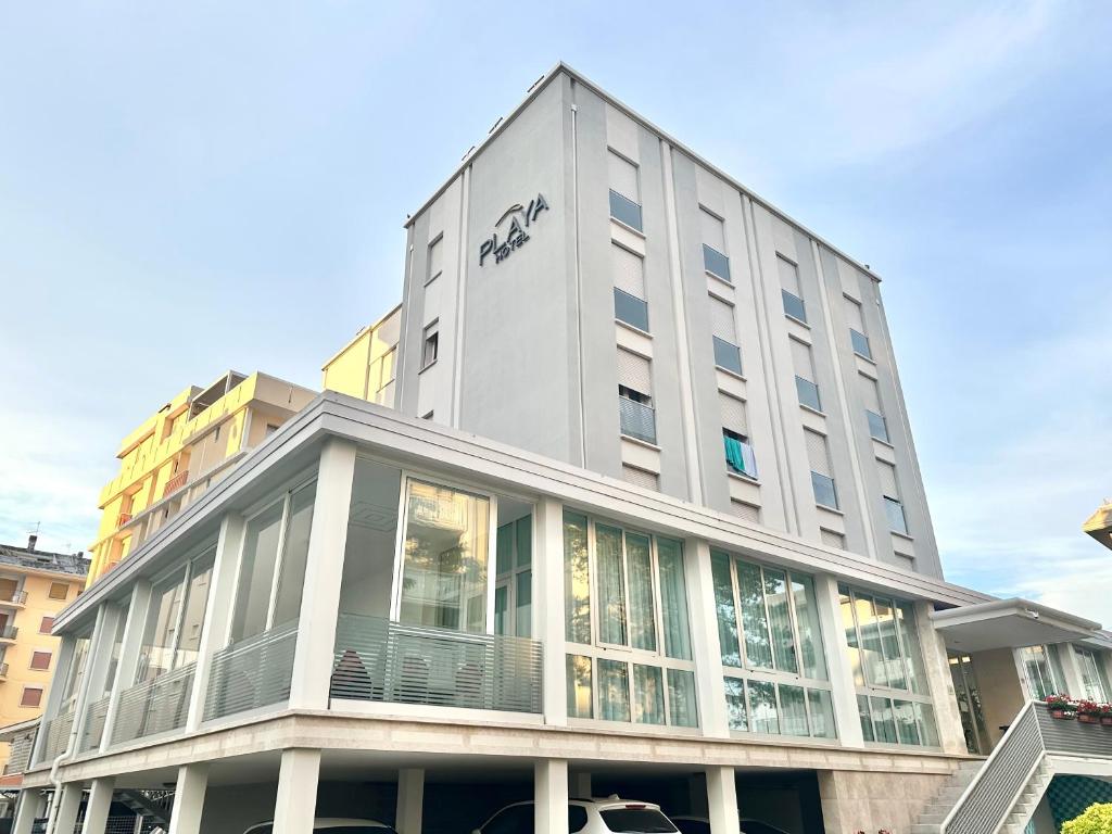 a building with an audi sign on the side of it at Hotel Playa in Bibione