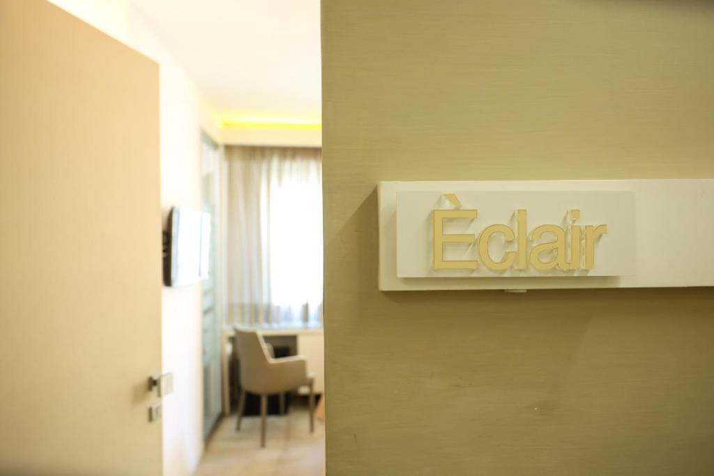 an elevator sign in a room with a table at Chez Moi Tropea Centro in Tropea