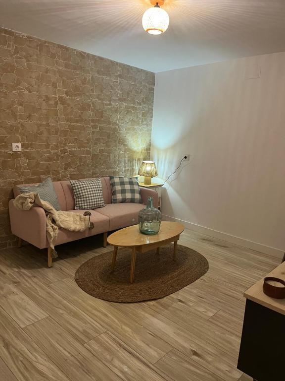 a living room with a couch and a coffee table at El Olivo Verde 2 in Jaén