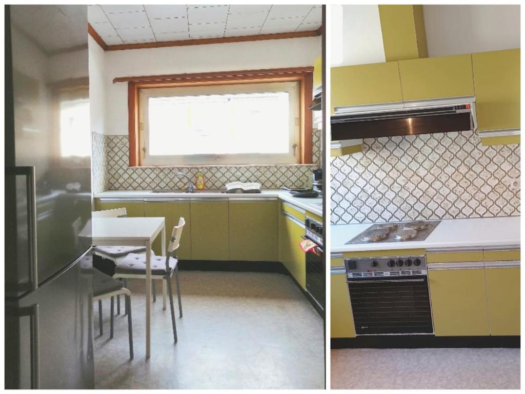a kitchen with yellow cabinets and a table and a sink at La Doudou Maison à louer in Mons