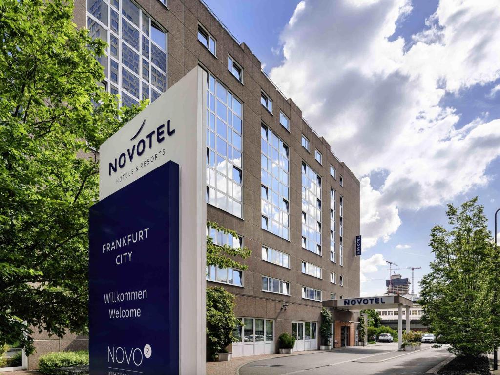 a building with a sign in front of it at Novotel Frankfurt City in Frankfurt