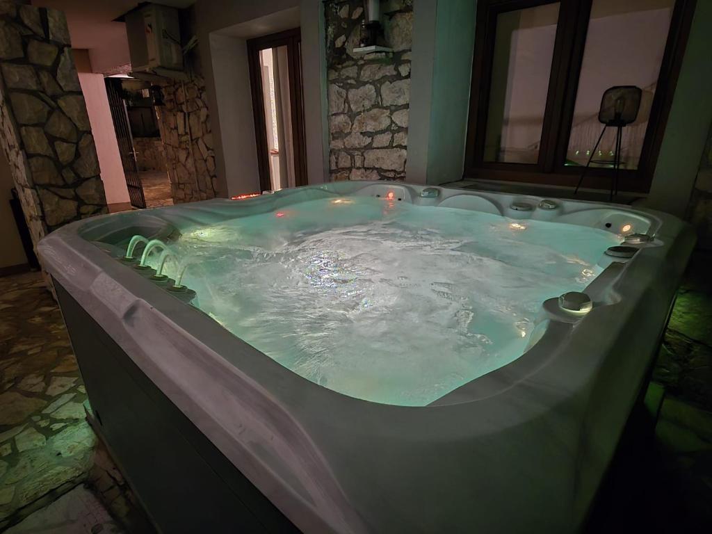 a large jacuzzi tub with lights in a room at Loro House & Jacuzzi in Posedarje