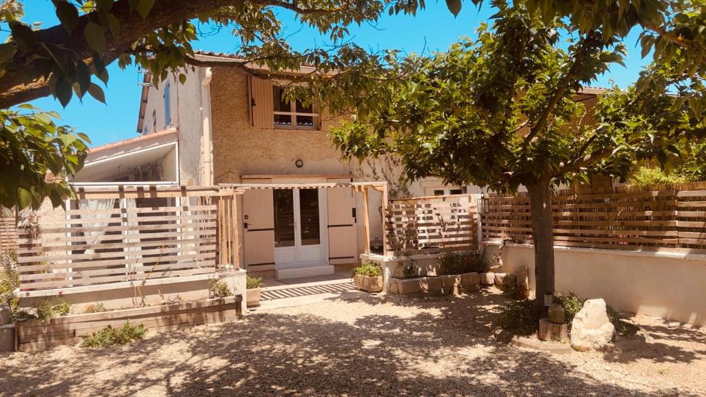 a house under construction with a tree in front of it at Villa Sainte Anne in Sénas