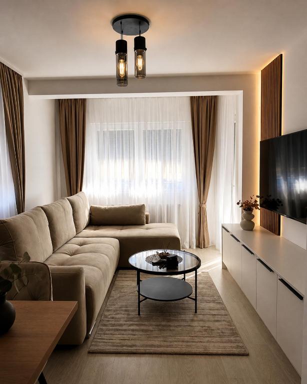 a living room with a couch and a table at Veles in Banja Koviljača