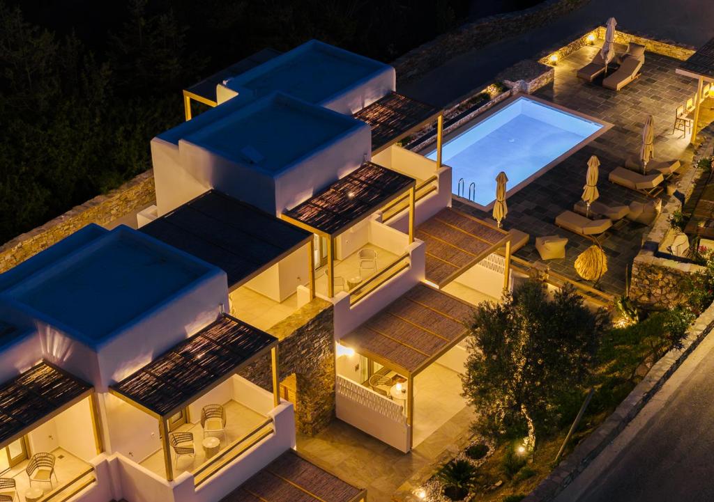 an aerial view of a house with a swimming pool at Miles Away Residences in Platis Gialos