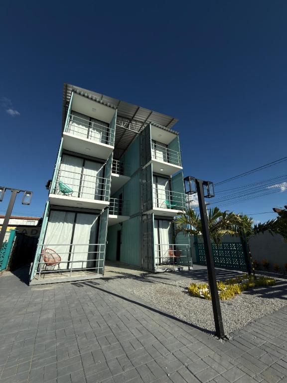 a tall building with balconies on the side of it at Riovale Container Lofts in Petrolina
