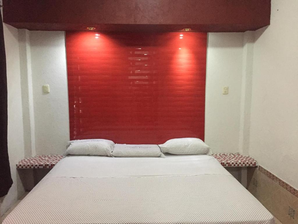 Postel nebo postele na pokoji v ubytování Hotel Paraiso Express
