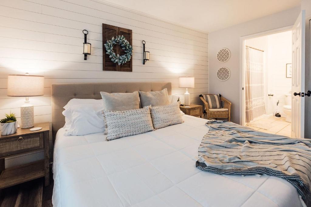 a bedroom with a large white bed with pillows at Spacious 3 Bed Condo Near ETSU in Johnson City