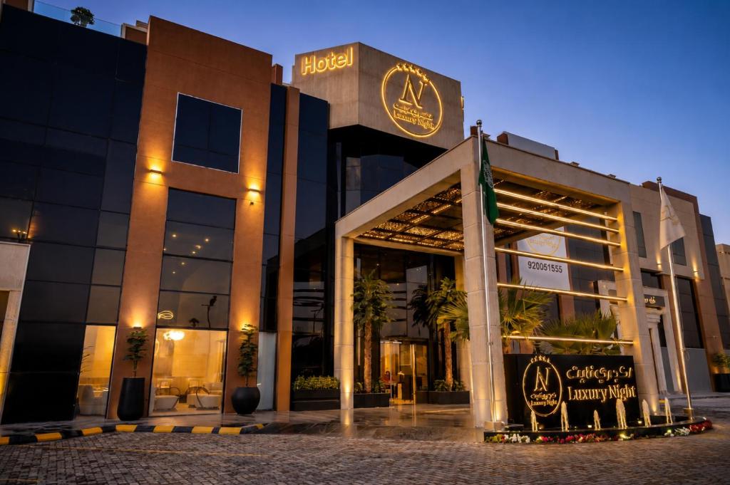 a store front of a building at night at Luxury Night Hotel Al Yasmin in Riyadh