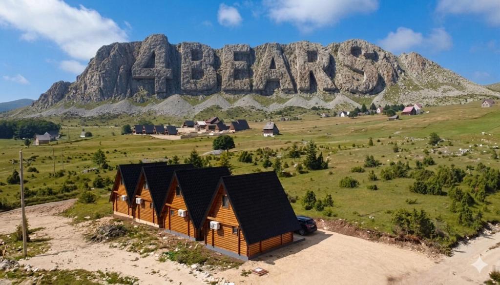 a cabin in front of a mountain with the ac barns sign at 4 BEARs in Kovačka Dolina