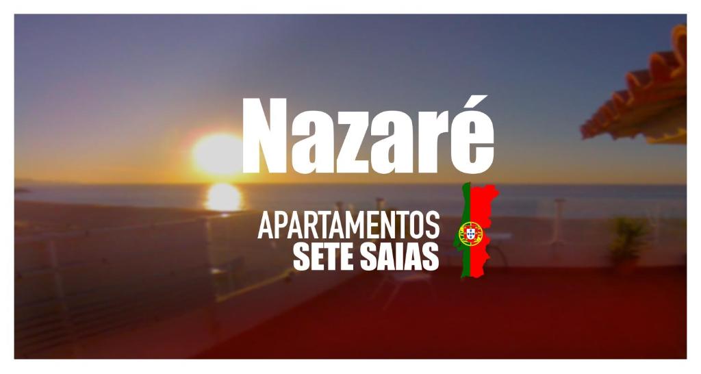 una señal con las palabras Nahara con una puesta de sol en el fondo en Apartamentos 7 Saias Marginal, en Nazaré