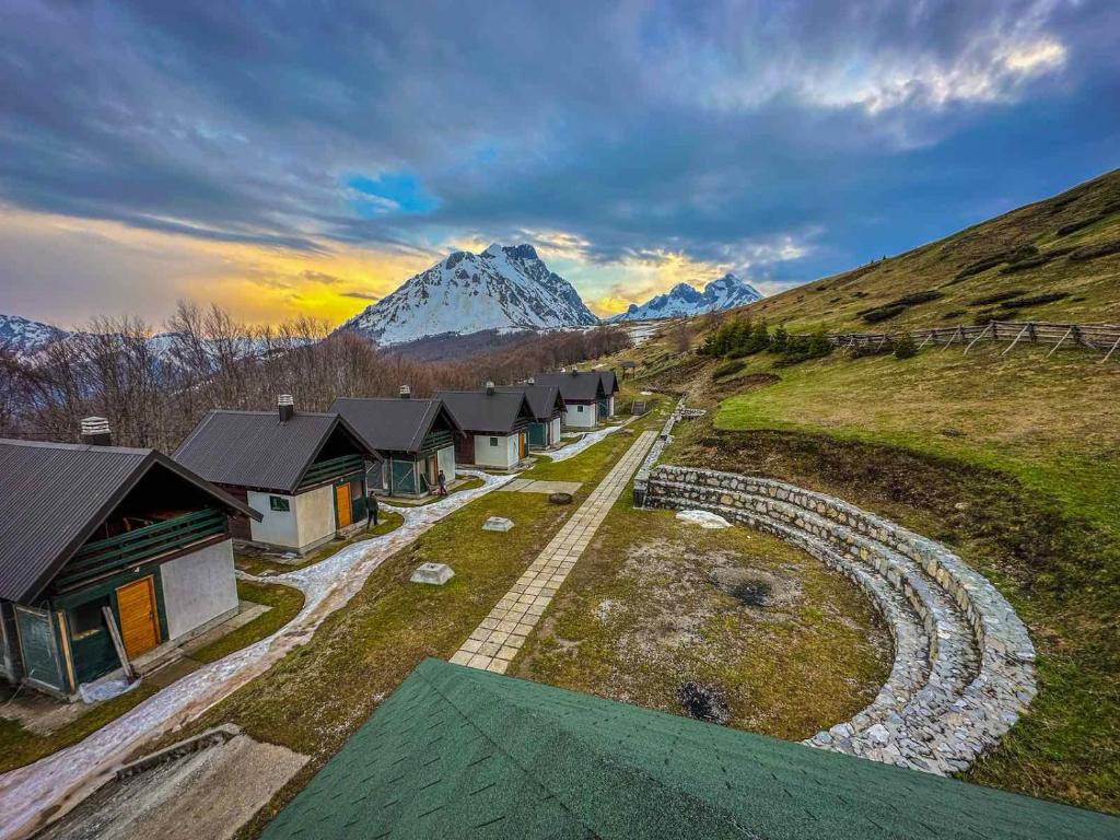 an aerial view of a group of houses on a mountain at Katun Komovi in Andrijevica
