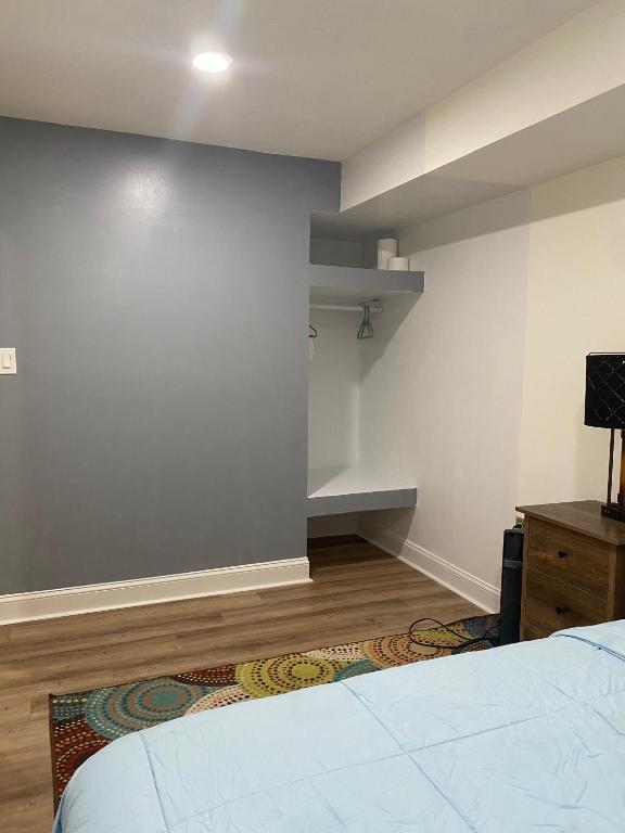 an empty room with a bed and a closet at Sakisa International in Waldorf